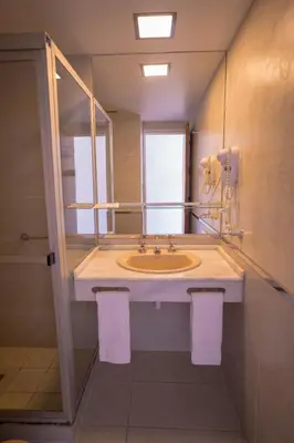 a bathroom with a sink and a mirror at Santa Cecilia Boutique in Villa Carlos Paz