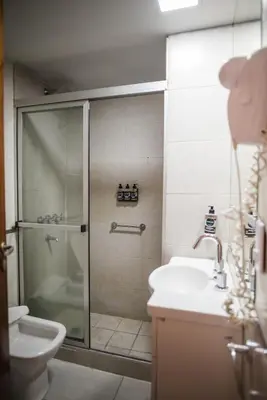a bathroom with a shower and a sink and a toilet at Santa Cecilia Boutique in Villa Carlos Paz