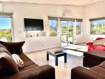 a living room with a couch and a table at Anubis in Merlo
