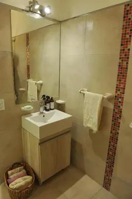 a bathroom with a sink and a shower at Villaloma in Villa Carlos Paz