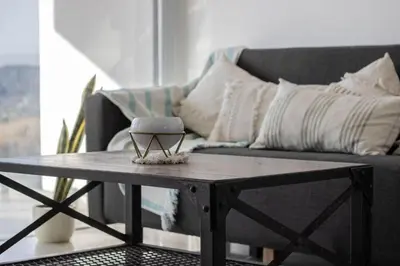 a coffee table in a living room with a couch at Villaloma in Villa Carlos Paz