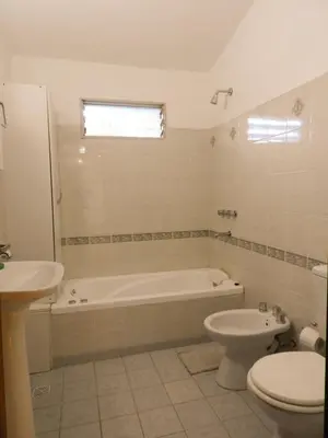 a bathroom with a tub and a toilet and a sink at Descanso Serrano in Tanti