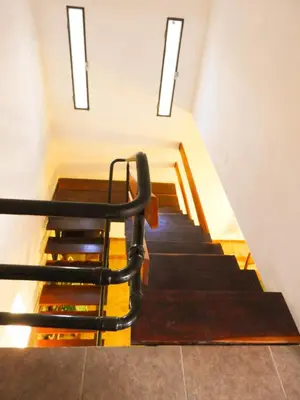 a stair case with a chair sitting on top at Descanso Serrano in Tanti