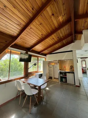 a kitchen and dining room with a table and chairs at loft interno in Villa General Belgrano