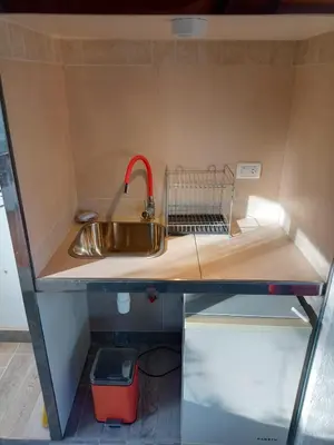 a kitchen with a sink in a small room at loft interno in Villa General Belgrano