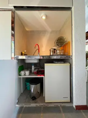 a small kitchen with a sink and a counter at loft interno in Villa General Belgrano