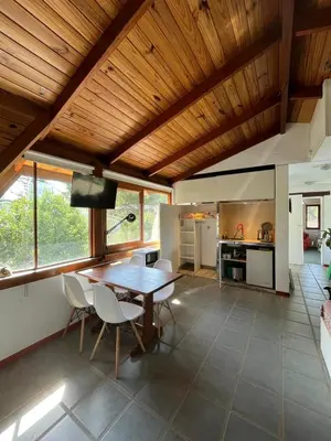 a kitchen and dining room with a table and chairs at loft interno in Villa General Belgrano