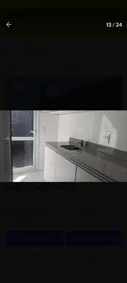 a view of a white kitchen with a window at Hermosa casa en Lomas Del Rey in San Antonio de Arredondo