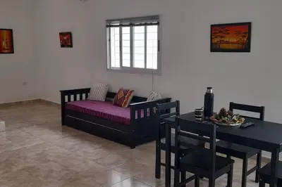 a living room with a couch and a table at Casa con vista a las sierras in Santa María