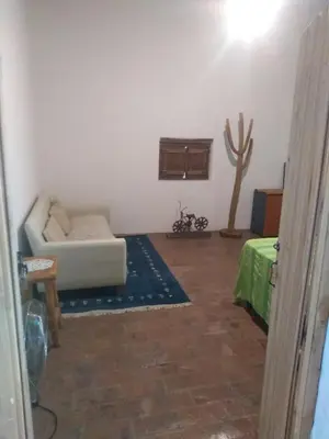 a living room with a couch and a table at Casa alma verde alegría y paz in Luyaba