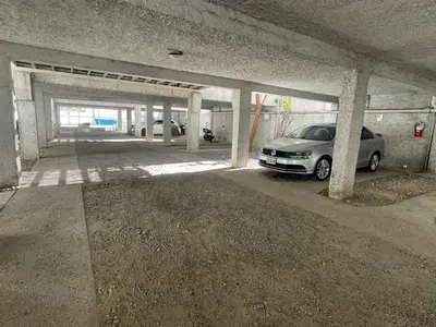 a parking garage with a car parked in it at 255 TUPUNGATO con COCHERA in Villa Carlos Paz