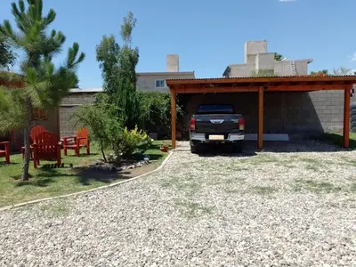 a truck parked under a pavilion in a yard at Cholito 2 in Alta Gracia