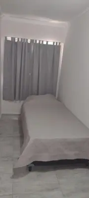 a bed in a room with a window at DEPARTAMENTO VILLA CARLOS PAZ CENTRO in Villa Carlos Paz