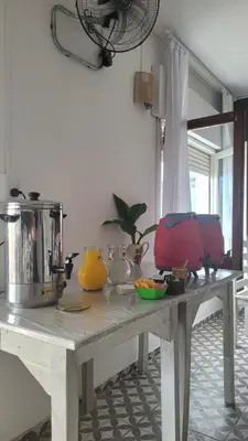 a table in a room with a counter top at American Hoteles in Villa Carlos Paz