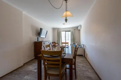 a dining room with a table and chairs at Excelente depto 2 habitaciones en Nueva cordoba By Lofty in Cordoba