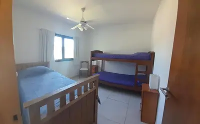 a bedroom with two bunk beds and a ceiling fan at El Paraiso - Jose de La Quintana in José de la Quintana