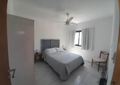 a white bedroom with a bed and a window at El Paraiso - Jose de La Quintana in José de la Quintana