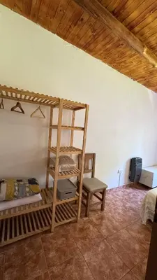 a room with a bunk bed and a ladder at LA FACUNDA in San Francisco del Monte de Oro