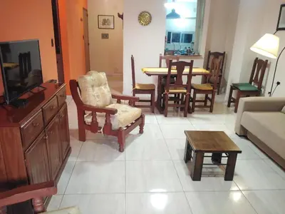 a living room with a couch and chairs and a table at Amplio departamento en Nueva Cordoba - Bv Chacabuco in Cordoba