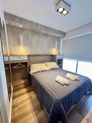 a bedroom with a bed with two towels on it at Estudio - apartamento cómodo y acogedor SS1 in Cordoba