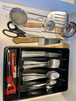 a drawer filled with lots of utensils at Güemes Premium, 2 dorm con Vista a las Sierras ALOHA #2 in Cordoba