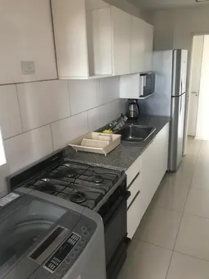 a small kitchen with a stove and a sink at Vista Privilegiada in Cordoba
