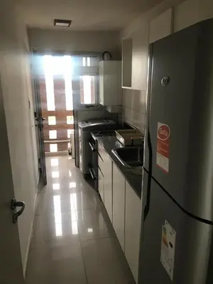 a kitchen with a refrigerator and a sink in it at Vista Privilegiada in Cordoba