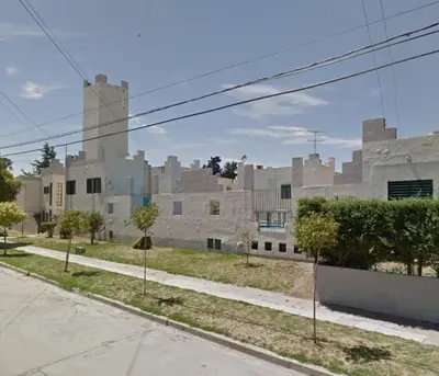 an empty street in front of a large building at Castillo Del Lago - Carlos Paz - D16 in Villa Carlos Paz