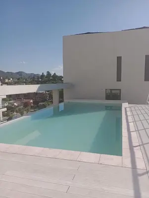 a swimming pool on the roof of a building at Lake Carlos paz in Villa Carlos Paz