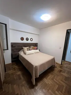 a bedroom with a bed in a room at Departamento HMP en la mejor zona Cordoba in Cordoba
