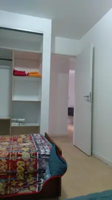 a bedroom with a bed and a room with a closet at Costanera 3 dormitorios 2 cocheras estamos a 800 metros del centro in Cordoba