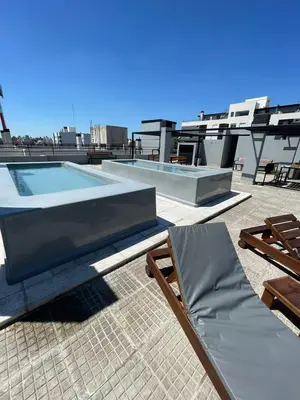 a swimming pool on the roof of a building at “Tu lugar en Cordoba 02” Depto SADIMA Guemes in Cordoba