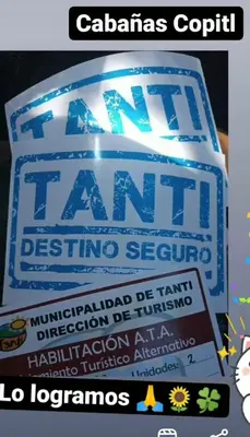 a sign that says the tiki land festival restoring seafood at CABAÑAS COPITL in Tanti