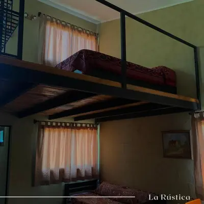 two bunk beds in a room with a bed at La Rústica in La Bolsa