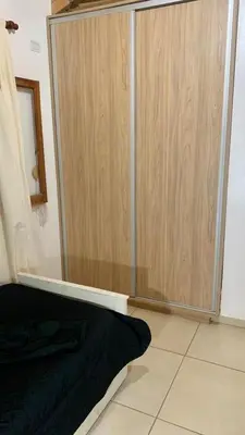 a closet with a glass door in a room at La Casita de Karen in Villa General Belgrano