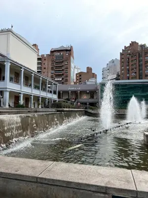 a fountain in the middle of a city with buildings at SUPER UBICACIÓN NUEVA CÓRDOBA in Cordoba