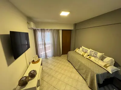 a bedroom with a bed and a flat screen tv at SUPER UBICACIÓN NUEVA CÓRDOBA in Cordoba
