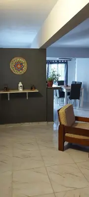 a living room with a couch and a table at Departamento 2 dormitorios Villa Carlos Paz in Villa Carlos Paz