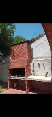 a brick oven in the side of a building at Depto Cura Gaucho in Mina Clavero