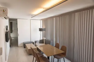 a dining room with a table and chairs at Babel Nueva Córdoba in Cordoba