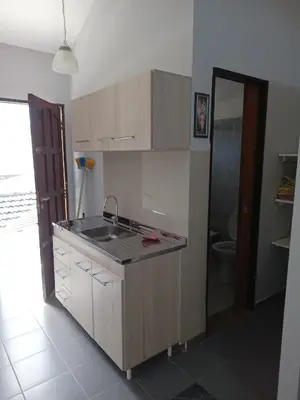 a kitchen with a sink and a toilet in a room at Dpto Santa Rosa in Santa Rosa de Calamuchita
