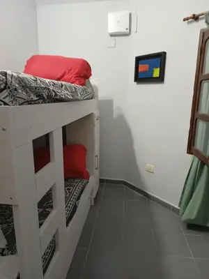 a room with two bunk beds in a room at Dpto Santa Rosa in Santa Rosa de Calamuchita