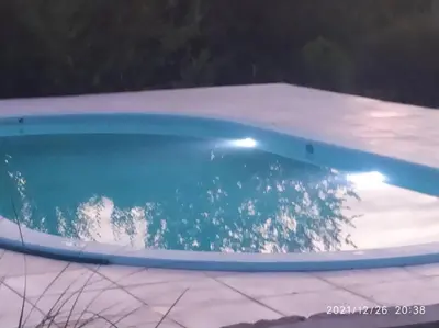 an empty swimming pool with blue water in it at Cabaña LA PEDRERA - Pileta y a metros del Rio in Bialet Massé