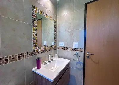 a bathroom with a sink and a mirror at Complejo La Dorada in Merlo