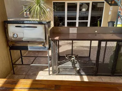 a table with a toaster on top of it at MIRALEJOS 6 CENTRO in Villa Carlos Paz