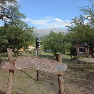 a sign for a park in the middle of a field at cabañas fátima in Villa de Las Rosas