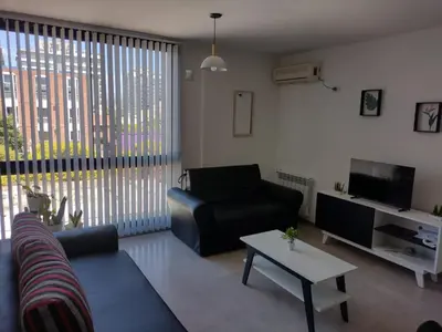 a living room with a couch and a table at Dto a estrenar Ctro V Carlos Paz in Villa Carlos Paz