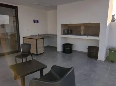 a room with chairs and a table and a counter at Dto a estrenar Ctro V Carlos Paz in Villa Carlos Paz