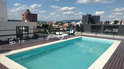 a swimming pool on the roof of a building at Dto a estrenar Ctro V Carlos Paz in Villa Carlos Paz