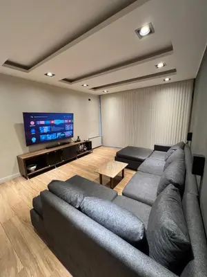 a living room with a couch and a flat screen tv at MAGIC DPTO - GENERAL PAZ in Cordoba